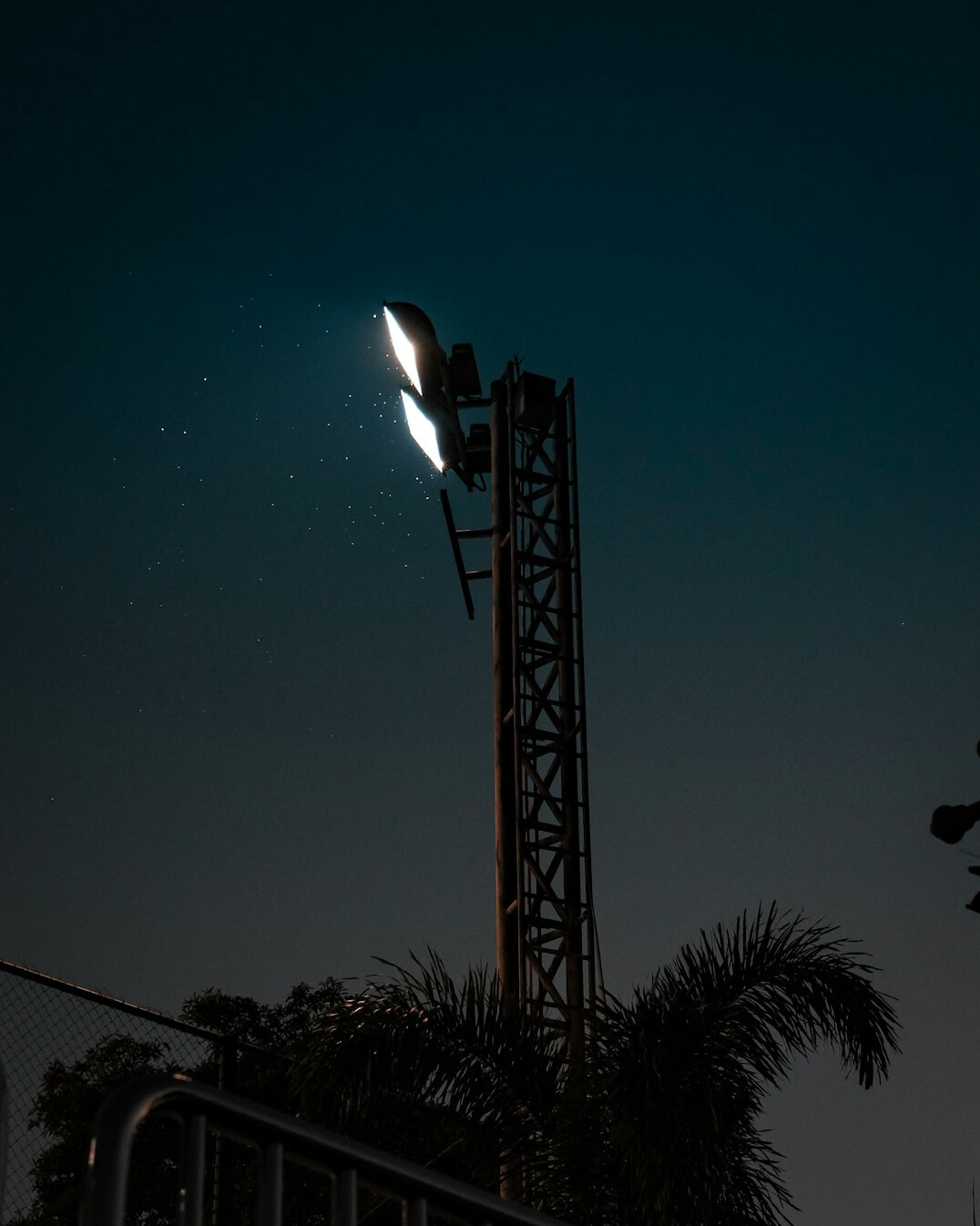 Stadium floodlights at dusk