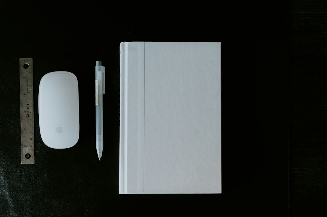 Journalist taking notes with a laptop and notebook
