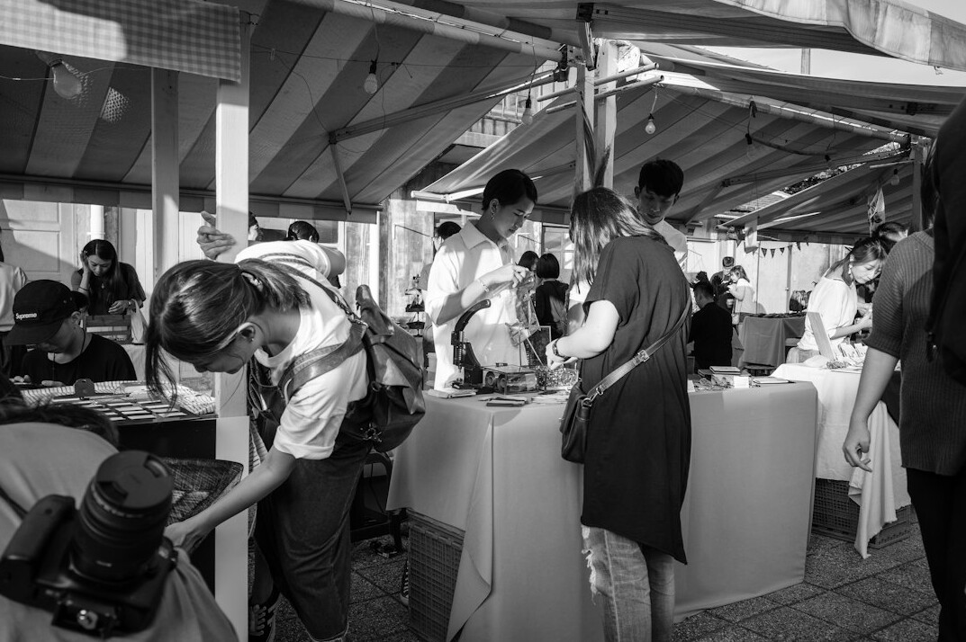 Press photographers with cameras at a media event