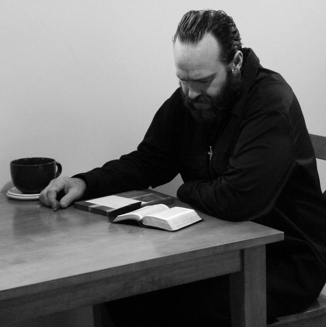 Editor reviewing documents at a desk