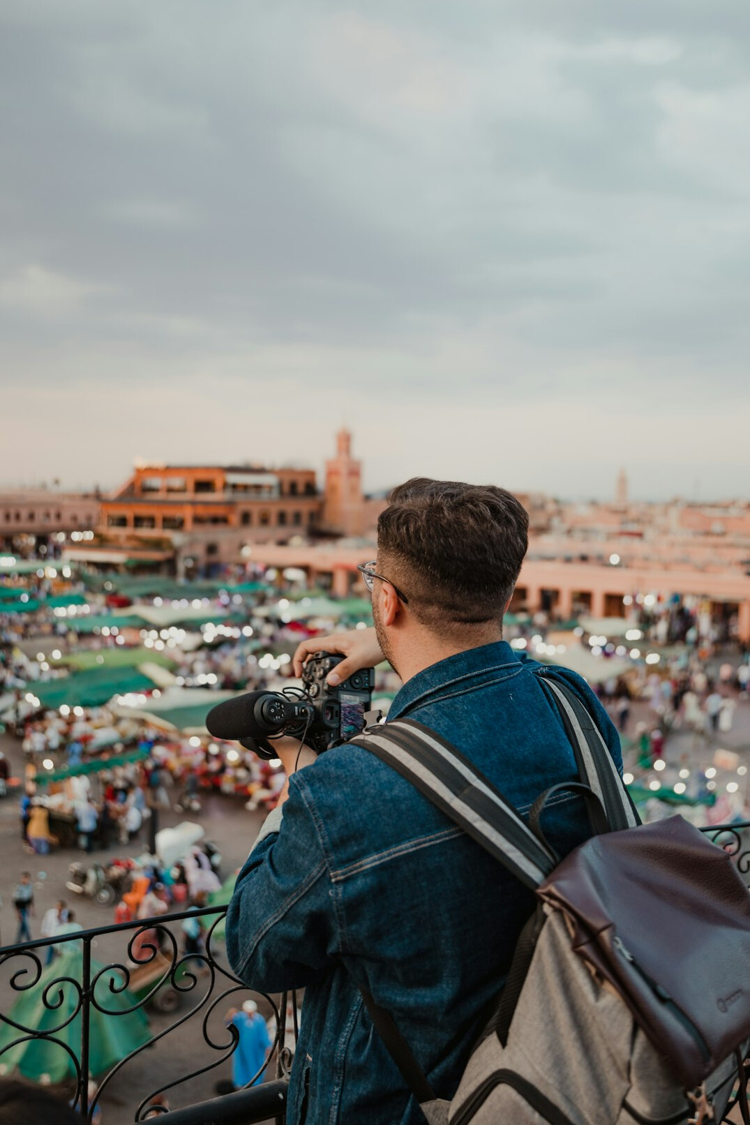 Photographer with camera at a public event